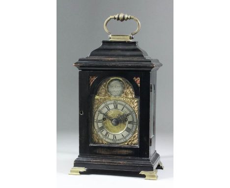 An unusual ebonised miniature bracket clock, the 3.5ins arched brass dial with silvered chapter ring with Roman and Arabic nu