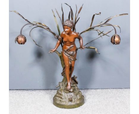 After Rigual - Bronzed spelter electric table lamp in the form of a standing maiden amongst bulrushes, on circular base, 28in