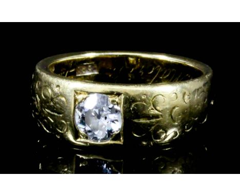 An 18ct gold mounted solitaire diamond ring, cushion set with a round brilliant cut diamond (approximate weight .50ct) and wi