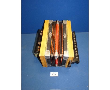 A small Accordion in original box and supplied by J.W. &amp; E. Austin, 4 Mealcheapen St., Worcester.