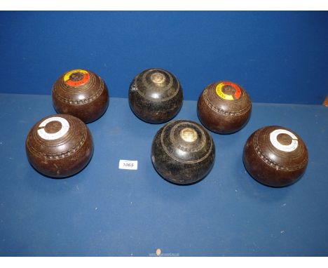 A set of brown Hemselite Lawn Bowls, size 4 7/2, plus two trophy bowls with presentation discs, engraved C. E. Watkins Winner