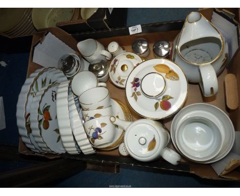 A quantity of Royal Worcester 'Evesham' china including; flan dishes, cups, saucers, biscuit barrel, jugs, coffee pot etc.