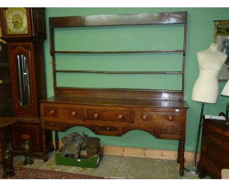 A peg-joyned Oak Welsh Dresser having three frieze drawers with three spice/trinket drawers below, all with turned wood knobs