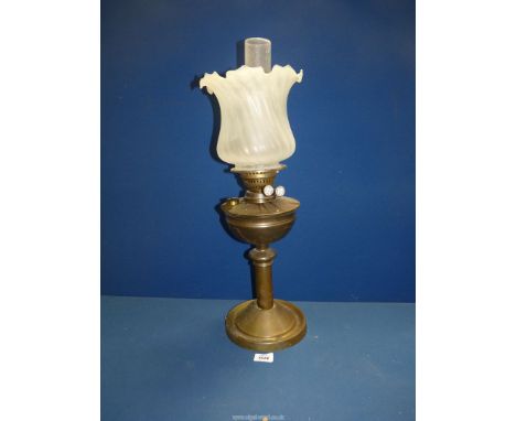 A Victorian Oil lamp with metal base and reservoir with frosted glass shade, 24" tall, a/f.