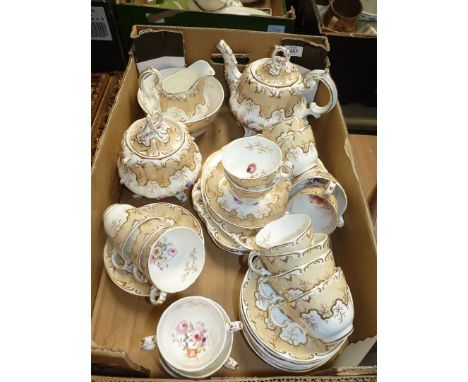 A quantity of teaware including; cream and gold teapot having floral design, cups, saucers, sandwich plates, milk jug, slop b