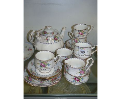 A Royal Albert Teaset in "Petit point china" pattern comprising of a six cups, saucers, and tea plates a teapot milk jug and 