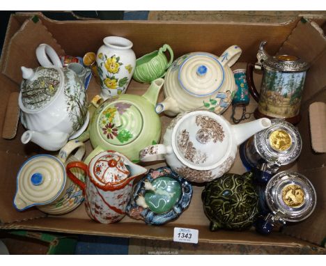 A quantity of teapots including Country Cottage, Cottage by a stream, 1970 teapot, together with a Portmeirion vase (Gossypiu