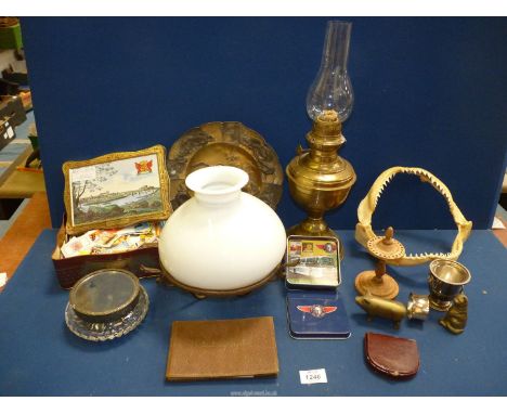 A quantity of miscellanea to include; Japanese Samurai metal plate, oil lamp parts, shark teeth and a tin of match labels, et