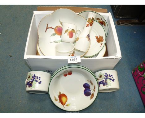 A Royal Worcester 'Evesham' fruit bowl and oval dish, small jug etc plus 'Evesham Vale' cups, saucers and fruit bowls.