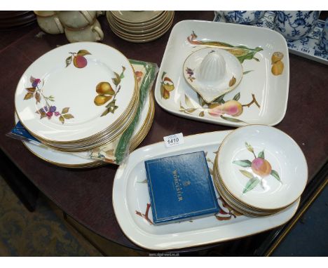 A quantity of Royal Worcester 'Evesham' china including; dinner and side plates, dessert dishes, pie dish etc.