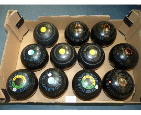 Two sets and three odd black Lawn Bowls including Hemselite Supergrip, Size 6, heavyweight model, Hemselite Supergrip, size 6