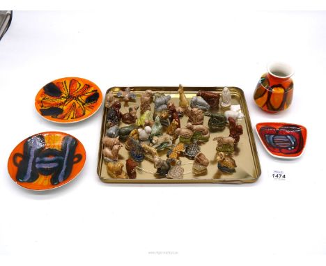 A quantity of Wade animals including dog, fish, bird, wild boar, frog etc. plus four small pieces of Poole Pottery 'Delphis' 