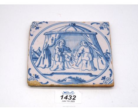 A scarce 17th century Dutch Delft tile depicting Judith standing in her tent with the head of Holofernes.  A tile with the sa