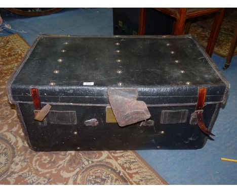 A leather bound trunk having striped lining and brass door lock, a/f. 32 1/2" long x 20 1/2" wide x 15 1/2" high.