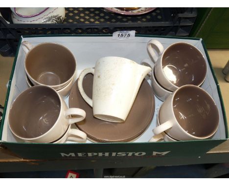 A small quantity of Poole Pottery cups, saucers, milk jug etc