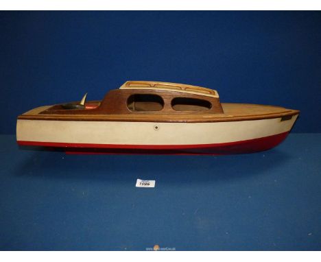 A wooden model of a vintage motorboat "Maggie" with a propeller, 25" long overall (some parts missing).