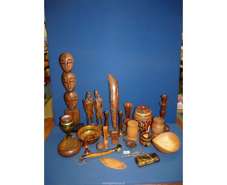 A quantity of treen including an oak candlestick, a tribal figure, a dice box, etc.