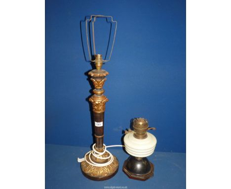 Two lamps, being an oil lamp and an electric wooden lamp. 22 1/2" x 11 1/2".