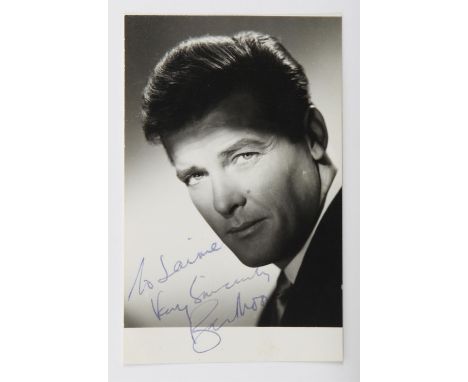 Roger Moore - A vintage signed 5 x 3 inch photograph as Simon Templar from The Saint TV series, inscribed To Jaime, Very sinc