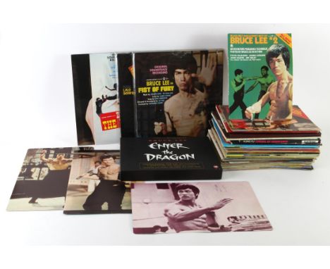 Collection of vintage Kung Fu items including Popster Bruce Lee poster magazine, Dragon - Kung Fu Monthly Magazine, Legend of