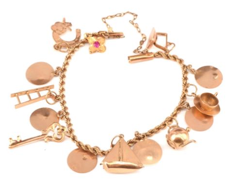 Egyptian gold charm bracelet, with twisted rope bracelet and tube lock clasp and 14 charms, including a tea cup, horse shoe, 