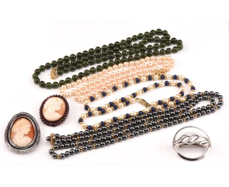 A group of costume jewellery, including two large shell cameo brooches, a circular scarf brooch 45mm in dia. stamped silver, 