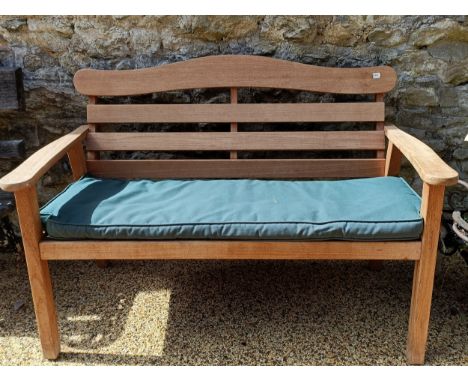 A wooden garden bench, 120 cm wideSplit to one of the legs, the backboard has slight play but feels firm and secure, Variatio