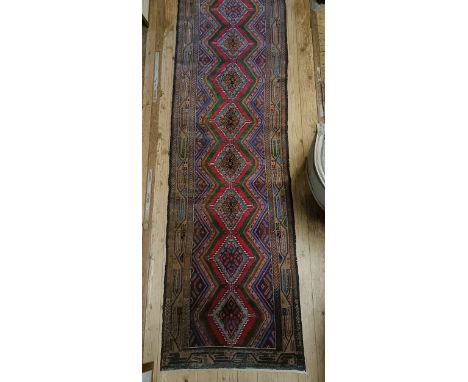 A red ground runner, 82 x 312 cm
