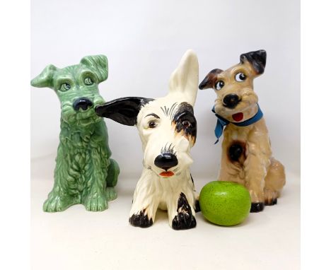 A Sylvac green dog, 30 cm high, a similar dog in plaster, 30 cm high, a Crown Devon dog (3)