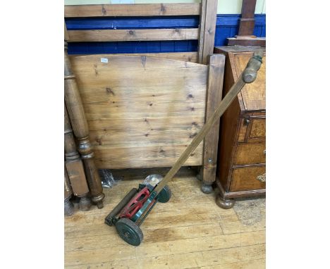 A vintage push along lawnmower, and assorted tools (qty)The wording on the cast wheels are British made " Climax"
