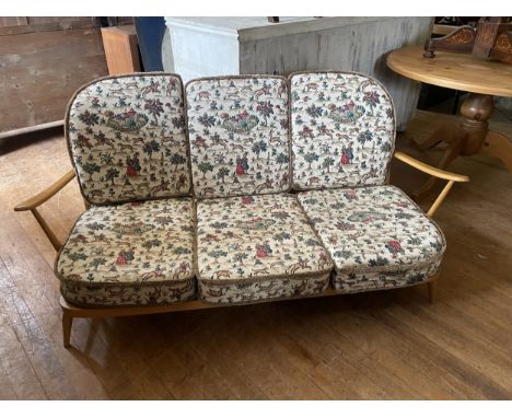 An Ercol three piece suite, two mirrors, a modern rug, a stool, and assorted prints and pictures (qty)