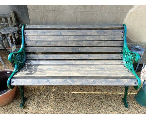 A garden bench, with painted metal ends, with wooden slats, 128 cm wide