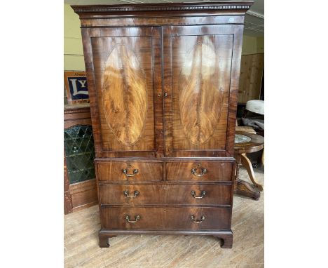 A mahogany linen press, converted to a wardrobe, 120 cm wideSmall splits throughout the linen press, doors are warped, cupboa