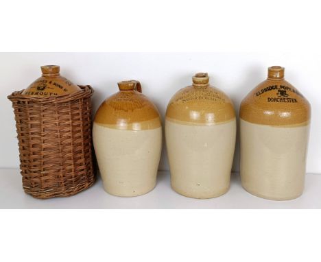 A stoneware bottle, stamped John Groves &amp; Sons, Weymouth, assorted other stoneware bottles, a watering can and a lamp (9)