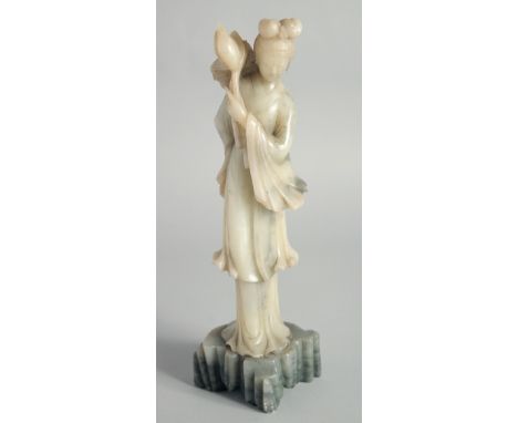 A CHINESE CARVED JADE FIGURE OF GUANYIN, 29cm high.