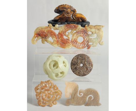 A COLLECTION OF SIX CHINESE HARDSTONE PIECES, comprising a jade puzzle ball, a tiger's eye figure mounted to a wooden stand, 