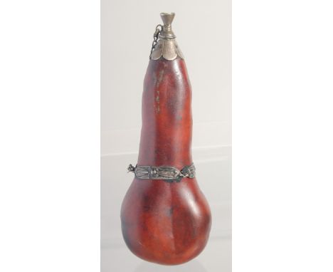 A SMALL POWDER FLASK, with metal mounts, possibly a type of nut, 16cm long.