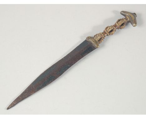 AN UNUSUAL 19TH CENTURY OR EARLIER AFRICAN BRASS HILTED DAGGER, 24cm long.