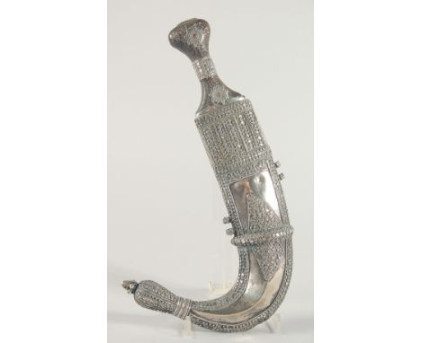 A FINE LARGE 19TH CENTURY RHINO HORN HILTED ARAB YEMENITE SILVER JAMBIYA DAGGER, 34.5cm in sheath.