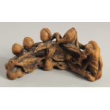 A CHINESE CARVED BAMBOO BRUSH STAND, 16.5cm long.
