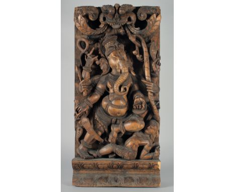 A LARGE INDIAN CARVED WOOD PANEL OF GANESH, 76.5cm x 37cm.