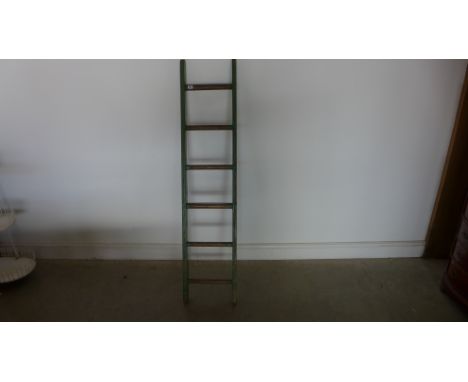 An old polished six rung ladder with original green paint - 159cm x 35cm