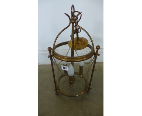 An early/mid 20th century glazed Hall lantern with three light fittings and brass bead decoration - Height 48cm 