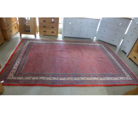 A Caucasian carpet with a red field - 330cm x 210cm - in good condition