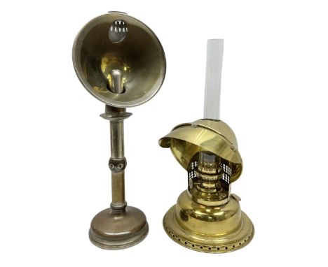 Two 19th century students desk lamps, comprising a brass oil example with peaked revolving shade and handle and a silver plat