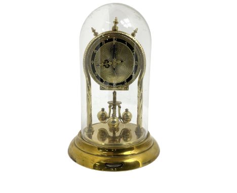 Schatz - mid-20th century German 400 day torsion clock, with a gilt dial and black chapter, Arabic numerals and pierced hands