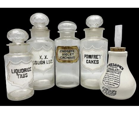 Four large late 19th/early 20th century apothecary jars, all bearing labels and with stoppers, to include a gilt and red line
