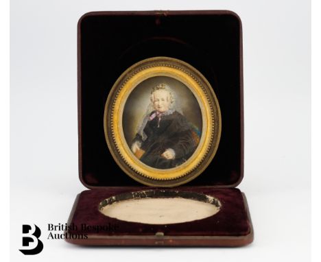 A Victorian photographic portrait miniature of a lady, hand coloured, in the original case. Note to back reads "Photographic 
