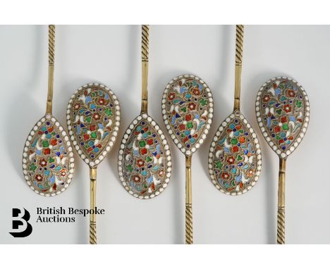 A set of six Russian silver-gilt and cloisonné enamel spoons in their original box. The fig-shaped bowls decorated with brigh