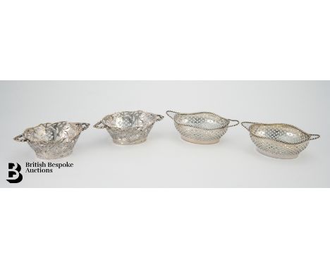 Pair of silver baskets, twin handled with pierced decoration, approx 11 x 7 cms (may once have had liners), Continental silve